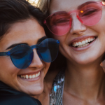 happy people wearing sunglasses